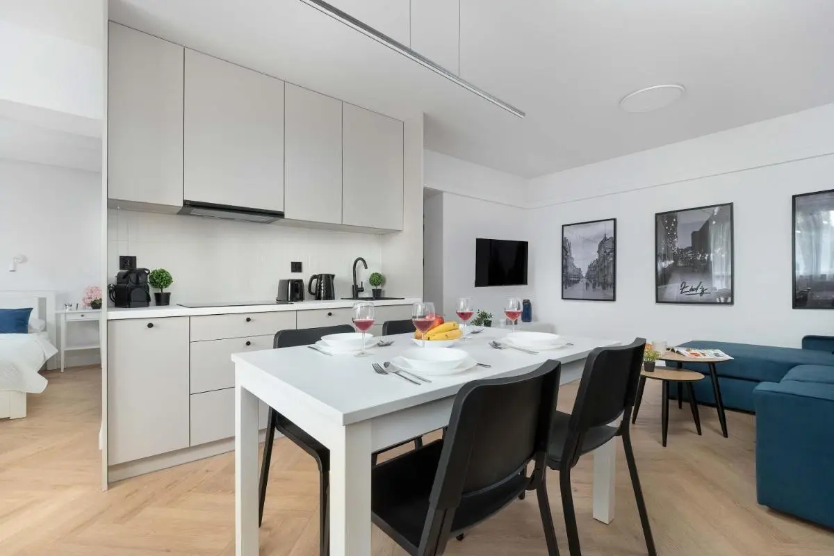 Image 3 of Blue and White Apartment in Łódź with Furnished Balcony by Noclegi Renters