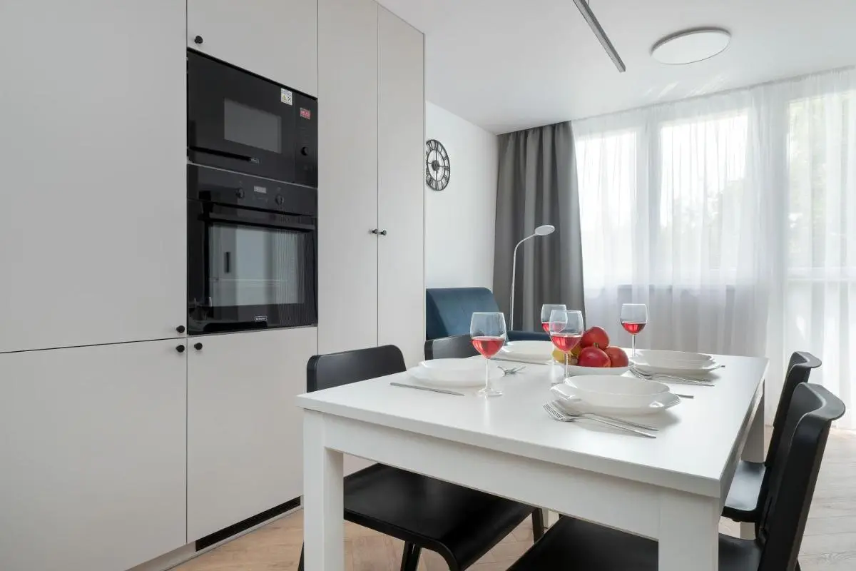 Image 6 of Blue and White Apartment in Łódź with Furnished Balcony by Noclegi Renters